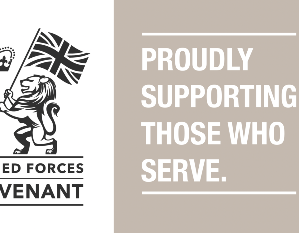 The logo of the Armed Forces Covenant features a lion holding a Union Cross flag